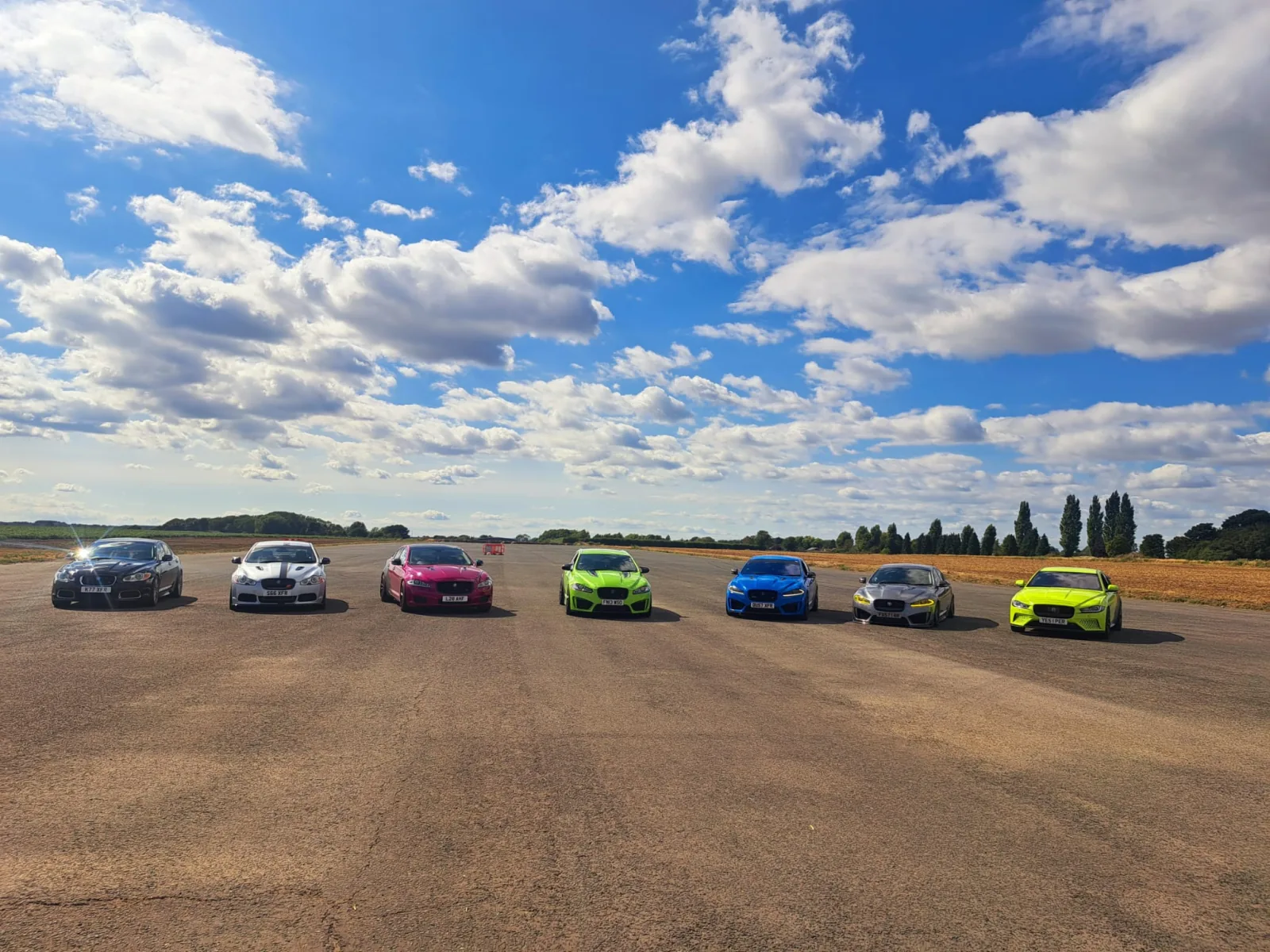 Line-up of Wraptor-tuned Jaguars at a UK track day